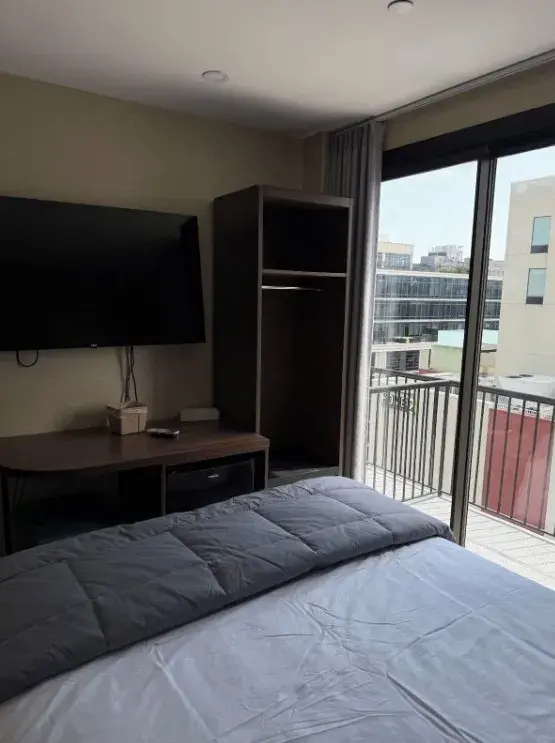 Skylux Hotel room workspace and private balcony